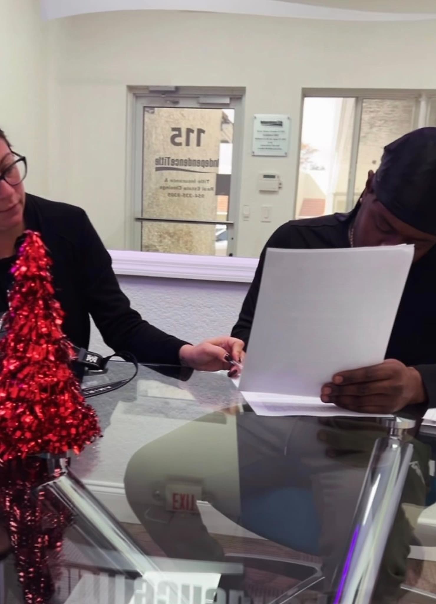 Seller's son reviewing final paperwork after probate at a South Florida cash home closing