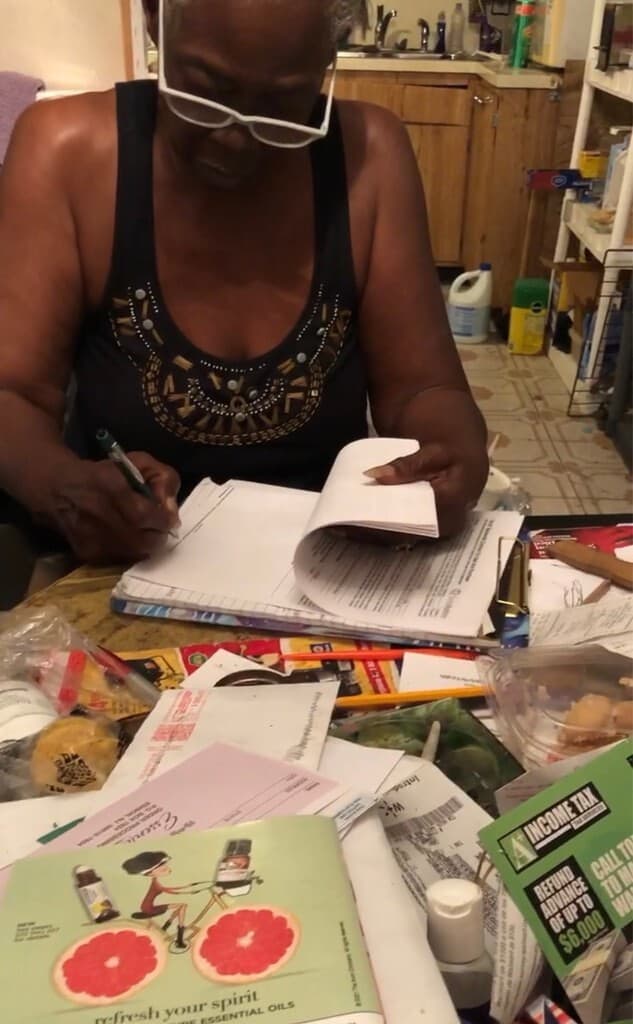 South Florida seller reviewing and signing cash-offer paperwork at home with Agility Equity